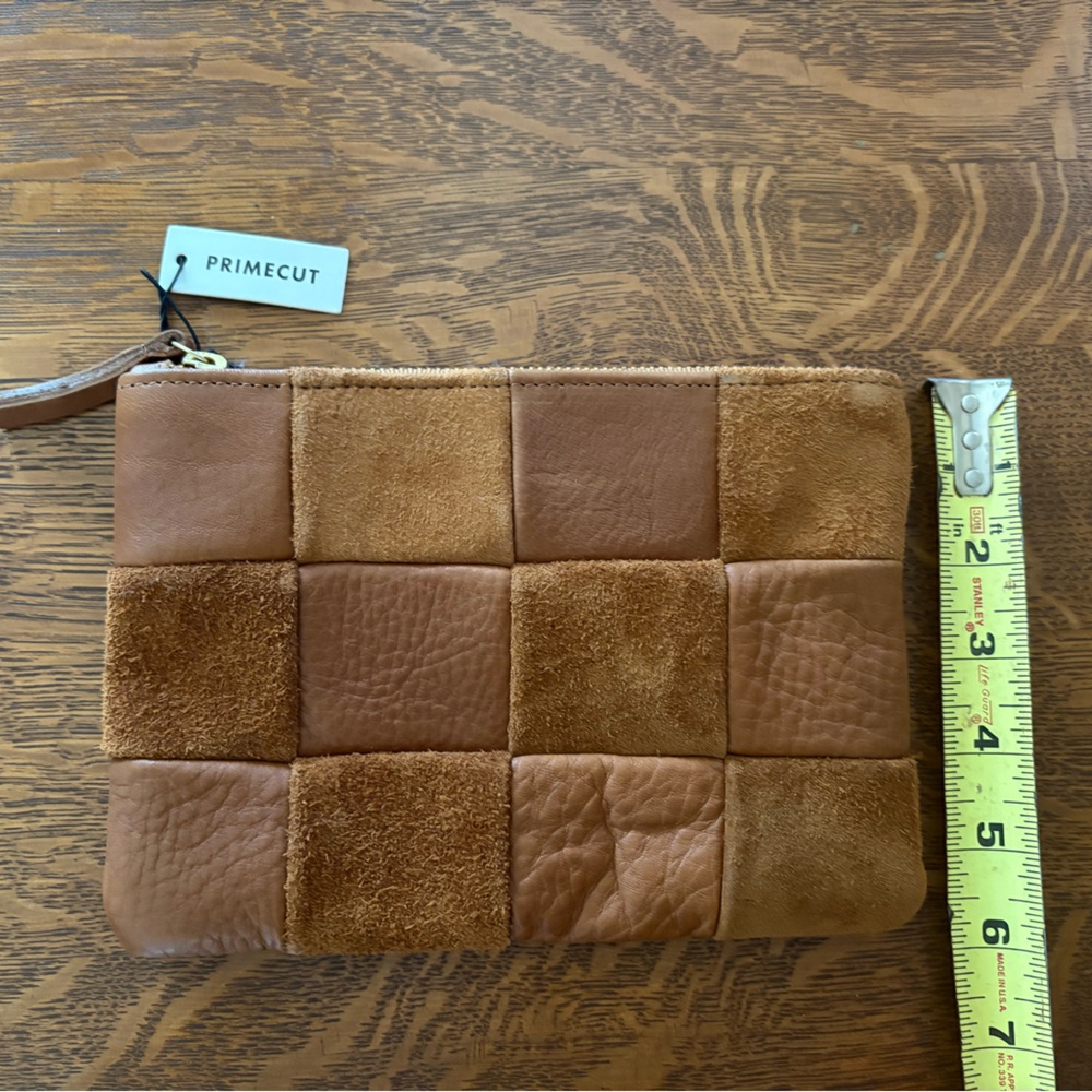 NWT Leather clutch by PRIMECUT. 6 x 8” zippered closure.